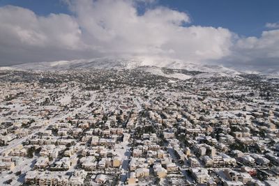 Aerial view of cityscape against sky