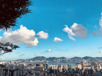 Panoramic view of city against blue sky