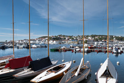 Boats moored at harbor