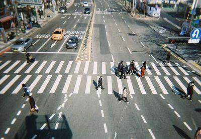 High angle view of people crossing road