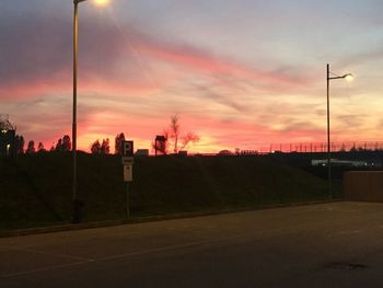 Road against cloudy sky at sunset