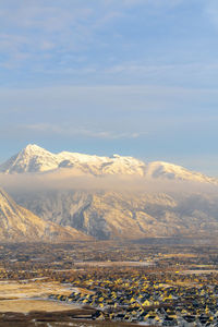 Scenic view of snowcapped mountains against sky