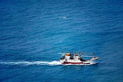 High angle view of sailboat sailing in sea