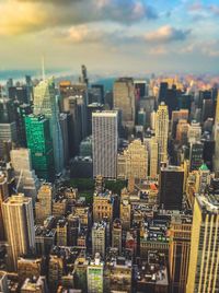 Aerial view of modern buildings in city against sky