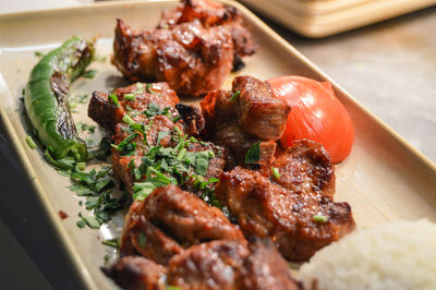 Close-up of meat served in plate on table