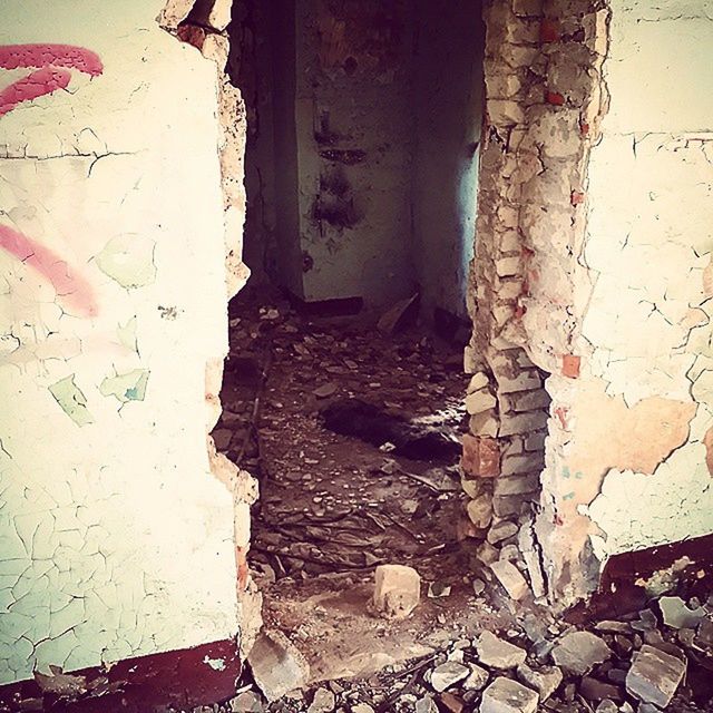 architecture, built structure, wall - building feature, wall, building exterior, weathered, old, abandoned, brick wall, damaged, deterioration, house, run-down, obsolete, door, graffiti, messy, day, textured, bad condition