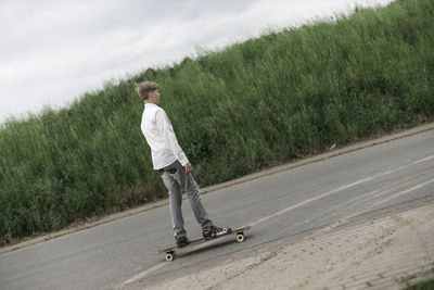 Young boy on longboard