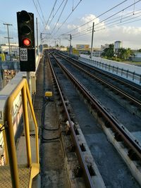 Train at railroad station against sky