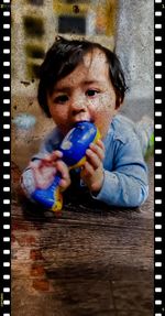 Portrait of boy eating food