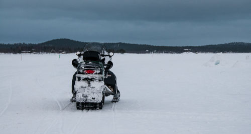 Snowmobile on inari lake in finland