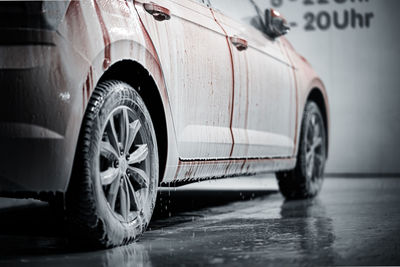 Close-up of wet tire in car