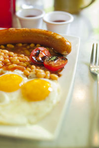 Close-up of english breakfast served in plate