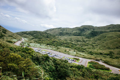 High angle view of road amidst mountains against sky