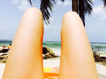 People relaxing on beach