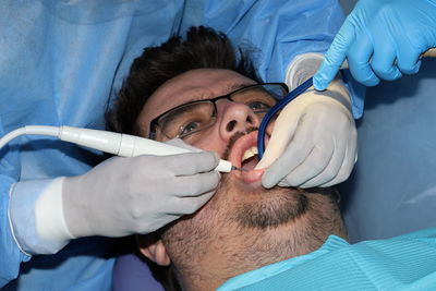 Midsection of doctor examining patient