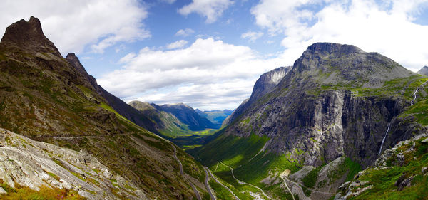 Scenic view of mountains against cloudy sky