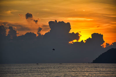 Scenic view of sea against orange sky