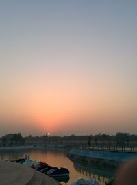 Scenic view of sea against clear sky during sunset