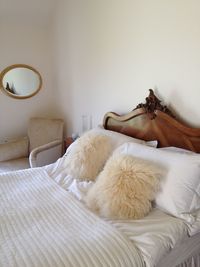 Photo of a comfy looking bed in a lovely decorated bedroom