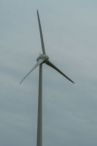 Low angle view of wind turbine against sky