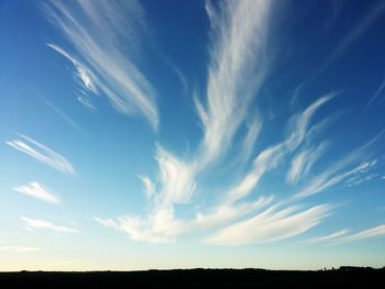 Scenic view of landscape against cloudy sky