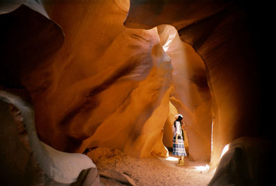 Side view woman in cave