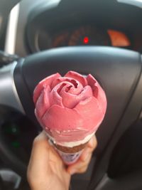 Close-up of hand holding ice cream