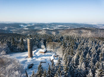 Aerial view of frozen landscape against clear sky