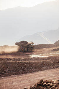 Mining activity, mining dump truck, high angle view of truck working on field