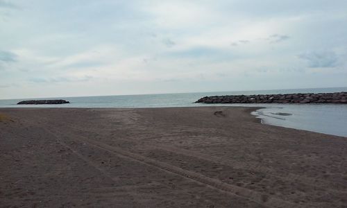 Scenic view of beach against sky