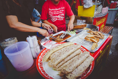 High angle view of woman preparing food on table