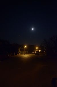 Illuminated street light at night