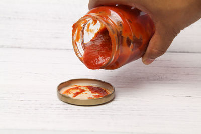 Close-up of hand on table