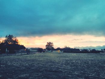 Scenic view of landscape against cloudy sky