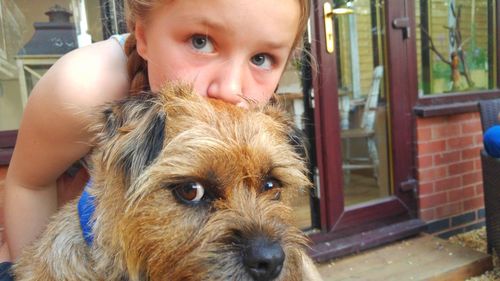 Portrait of cute girl with dog