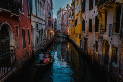 View on venezian gondola on canal after sunset