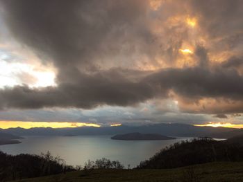 Scenic view of silhouette mountains against sky during sunset