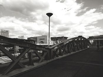 Bridge against sky in city