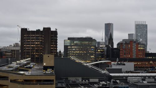 High angle view of buildings in city against sky