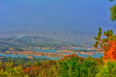 Scenic view of landscape and mountains against sky
