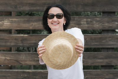 Portrait of young woman wearing hat