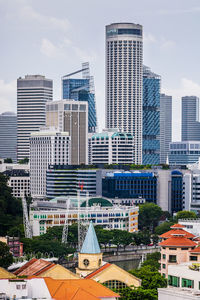 Modern buildings in city against sky