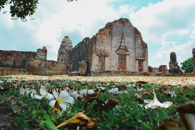 View of old temple against cloudy sky