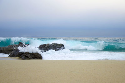 Scenic view of beach against sky