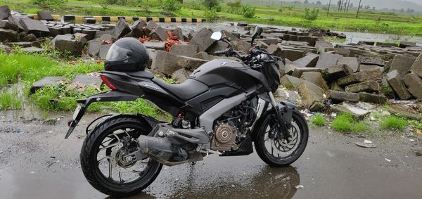 People riding motorcycle on road