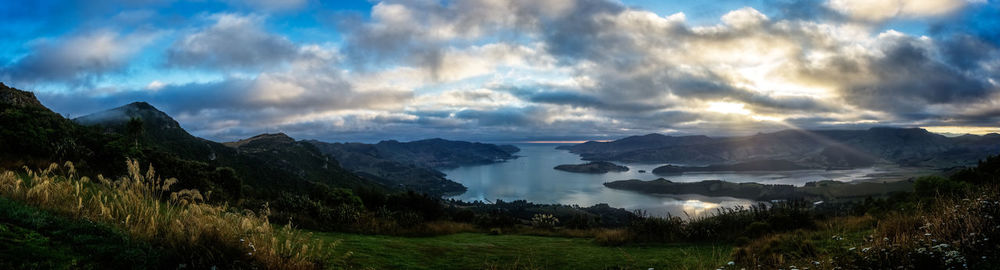 Scenic view of mountains against cloudy sky