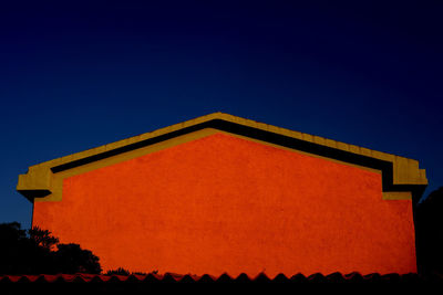 Low angle view of building against clear blue sky