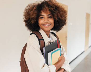 Portrait of young woman with curly hair