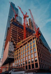 Low angle view of building site against sky