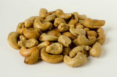 Close-up of roasted coffee over white background